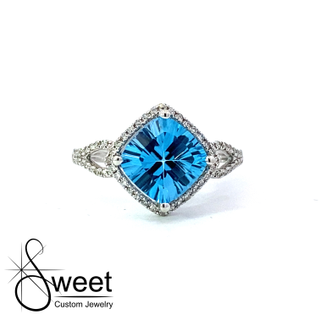 14kt white gold blue topaz and Diamond ring