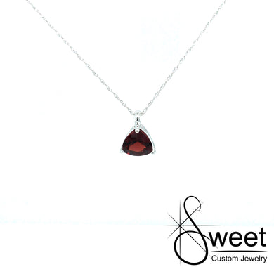 ONE 10kt WHITE GOLD PENDANT FEATURING ONE TRILLION SHAPED GENUINE GARNET