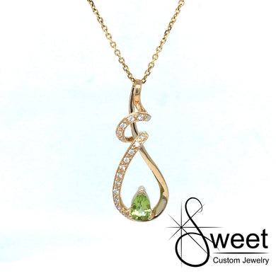 14K Yellow gold pendant featuring one pear shaped peridot