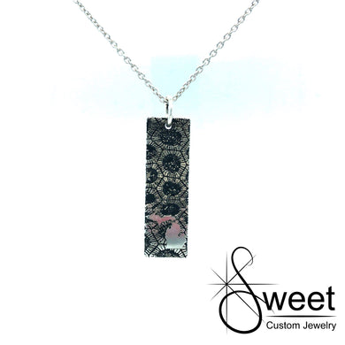 Handmade Sterling Silver Vertical Bar Pendant with Petoskey Stone pattern and shiny state of Michigan