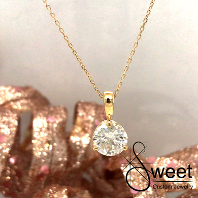 14KT YELLOW GOLD THREE PRONG PENDANT FEATURING ONE ROUND BRILLIANT CUT DIAMOND