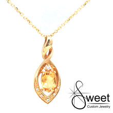 Load image into Gallery viewer, 14KT YELLOW GOLD MARQUISE SHAPED TWIST PENDANT FEATURING ONE OVAL SHAPED GENUINE CITRINE