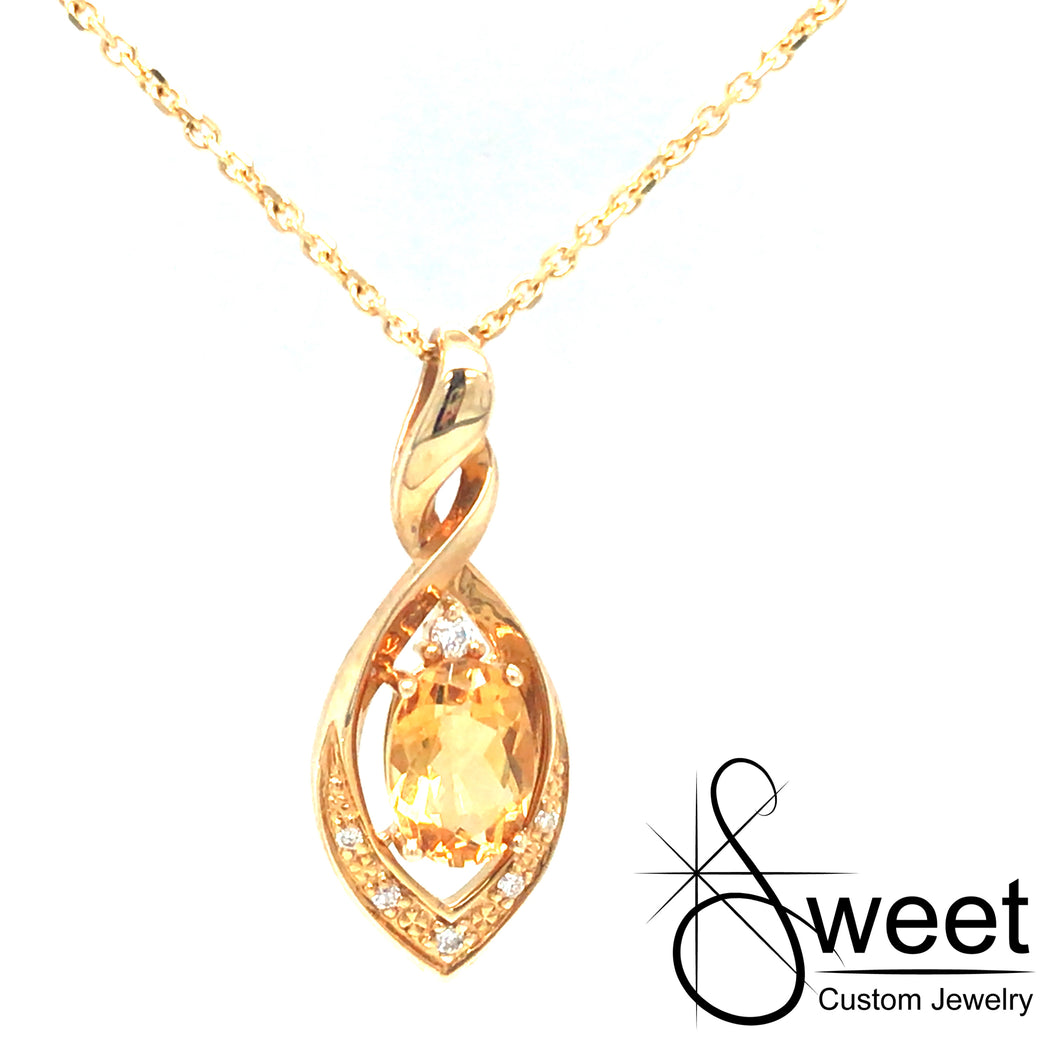 14KT YELLOW GOLD MARQUISE SHAPED TWIST PENDANT FEATURING ONE OVAL SHAPED GENUINE CITRINE