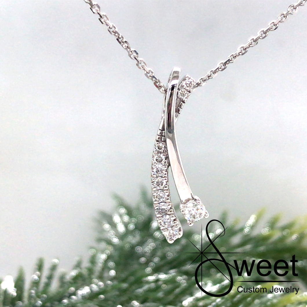 14kt WHITE GOLD TWO ROW PENDANT WITH ONE ROW OF ROUND DIAMONDS AND ONE HIGH POLISHED ROW WITH ONE LARGER ROUND DIAMOND
