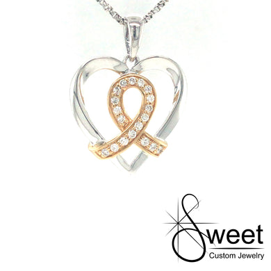 14KT WHITE GOLD HEART SHAPED PENDANT WITH YELLOW GOLD AND DIAMOND RIBBON IN THE CENTER