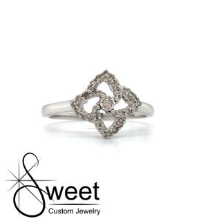 ONE LADIES 10KT WHITE GOLD FOUR POINT STAR RING FEATURING ROUND DIAMONDS,