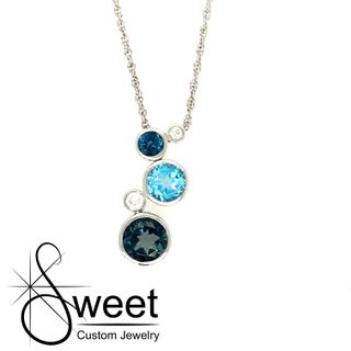 ONE 14KT WHITE GOLD PENDANT FEATURING BEZEL SET SWISS AND LONDON BLUE TOPAZ ACCENTED BY ROUND DIAMONDS