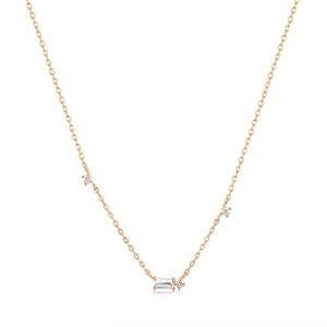 14kt yellow gold necklace featuring baguette white sapphires