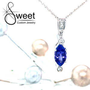 ONE 14KT WHITE GOLD TANZANITE PENDANT ON A 18 INCH SNAKE CHAIN FROM THE ESTATE COLLECTION