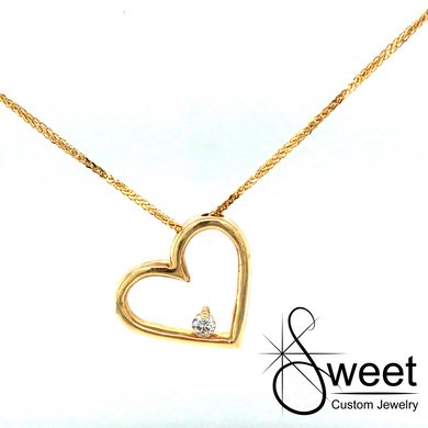 14KT YELLOW GOLD HEART PENDANT FEATURING ONE ROUND BRILLIANT CUT DIAMONDS .06CT, GH IN COLOR SI IN CLARITY